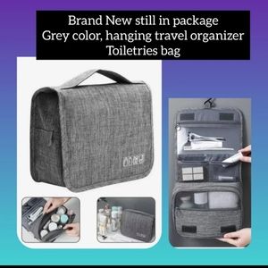 Brand New still in package, Grey color, hanging travel organizer toiletries bag